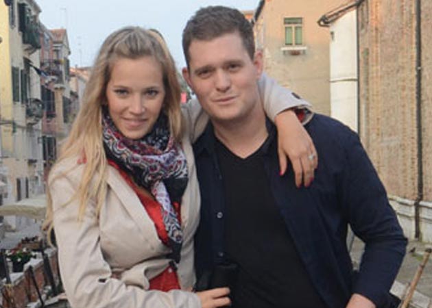 Singer Michael Buble's wife threw his clothes into pool to 'train' him 