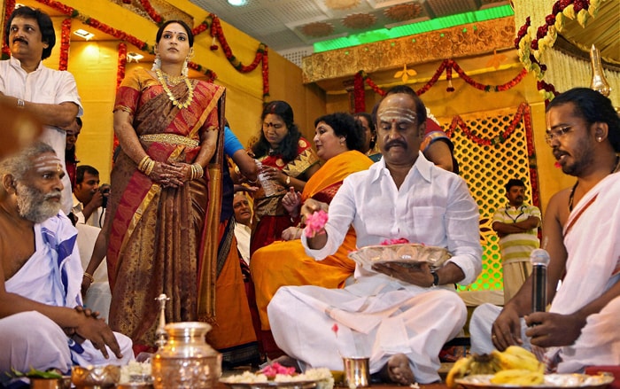 Actor Rajnikanth performs rituals during the wedding of his daughter Soundarya in Chennai