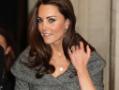 Poised Kate at first public meet without husband