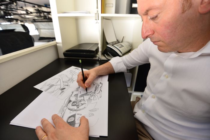Head of the Mazzanti Automobili, Luca Mazzanti is seen working on a drawing of an Evantra supercar in Mazzanti Automobili workshop in Pentedera near Pisa. - dv1525964