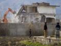 Pakistan razes bin Laden's home, erasing memories