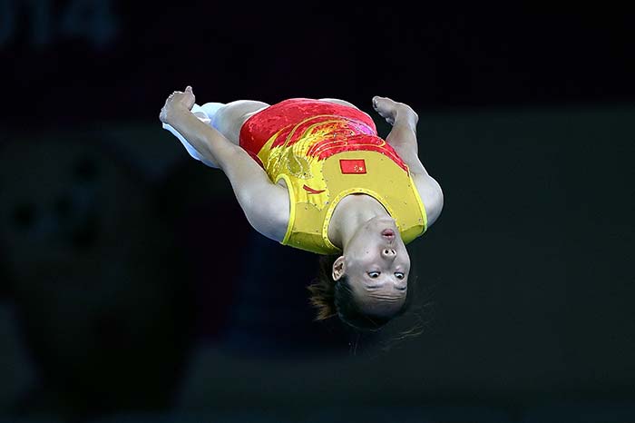 Zhong Xingping of China performs in the women's qualification round for the gymnastics trampoline event.