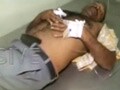 Video : Four injured, forty vehicles burnt in police firing near East Godavari
