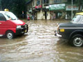 Video : Mumbai roads, trains hit by heavy rain