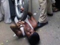 Video : Cops caught on camera riding bike on vegetable vendor's chest