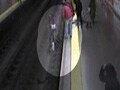 Video : Spain video shows police officer saving woman from tracks