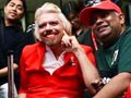 Video: Richard Branson dresses up as air hostess after losing bet
