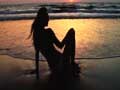 Sarah-Jayne enjoys the sunset on the beach