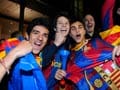 Fans celebrate Barcelona's win over Man U