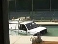 Video : Truck plunges into community swimming pool