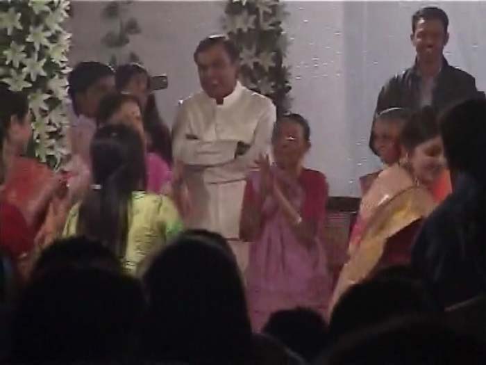 RIL chairman Mukesh Ambani enjoying dandiya at the family function.