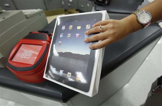 Wall Street's bar was so high for Apple Inc that the fact that it sold more iPads than Macs in the latest quarter wasn't enough to impress investors. Shares fell nearly 6 per cent after the release of results, even though Apple reported record net income and revenue as iPhone sales nearly doubled from a year ago.