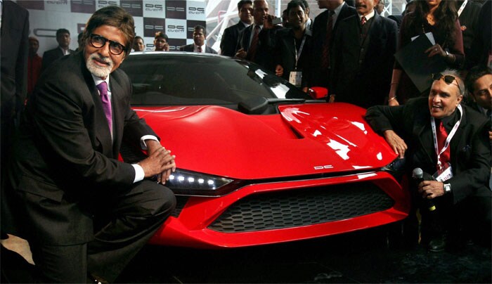 Bollywood actor Amitabh Bachchan poses next to the Supercar-DC Avanti Auto Expo 2012.