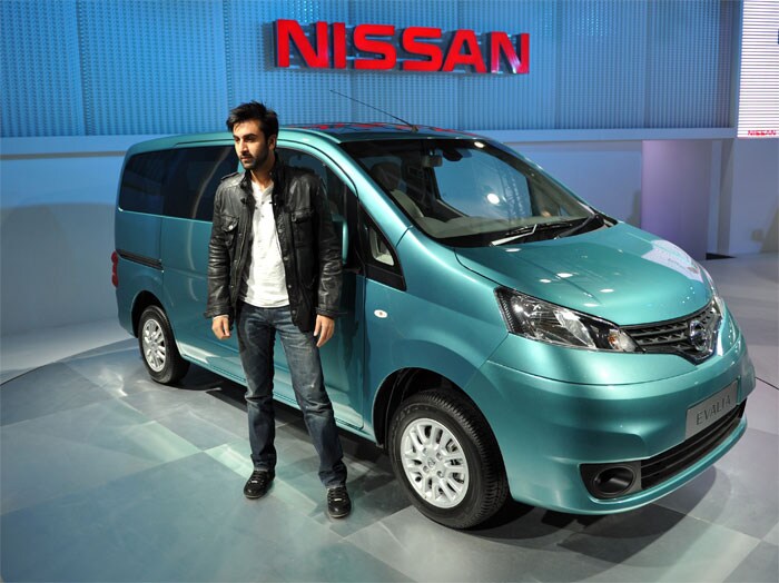 Bollywood actor Ranbir Kapoor poses with the newly launched Nissan Evaila during the Auto Expo 2012