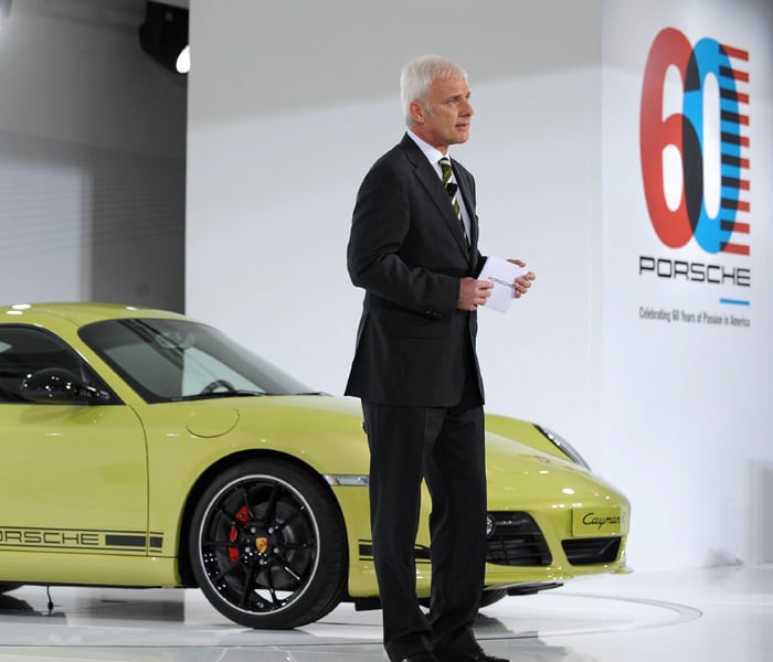 Porsche's President and CEO Matthias Muller reveals the 2011 Porsche Cayman R on at the LA Auto Show. Porsche Cayman R goes on sale in February 2011, at a price of $66,300. (Photo: AFP)