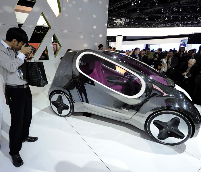 Kia POP ? the 118-inch-long three-seater, first introduced at the Paris Motor Show in September, is a mashup of present day (a zero-emissions electric vehicle) and distant future (a world more accepting of oblong windows paired with butterfly doors). (Photo: AFP)