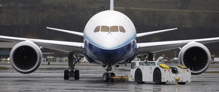 The first production Boeing 787 is seen on the tarmac after its first flight in Seattle on Tuesday. Deteriorating but typical Northwest winter weather ? rain, cold and wind ? brought the plane back about an hour earlier than planned. (AP photo)