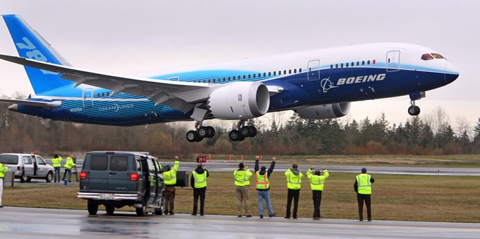 Boeing employees cheer as a 787 Dreamliner takes off from the runway at Paine Field in Everett, Wash. on Tuesday morning, Dec. 15, 2009. Boeing, which has orders for 840 of the jets, plans to make the first delivery to Japan's All Nippon Airways late next year.