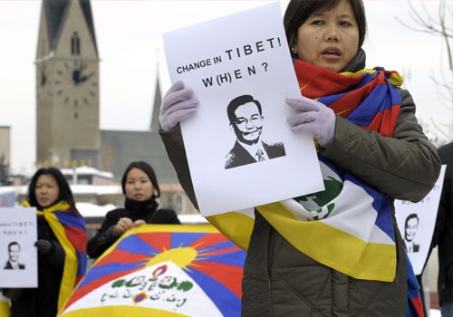 <b>Voices of discord:</b> Supporters of Tibet protest against the presence of Chinese Premier Wen Jiabao at the opening day of the Annual Meeting of the WEF. China has ruled Tibet since 1951 and the Dalai Lama, has lived in exile in India since fleeing his homeland after a failed uprising in 1959 against Chinese rule. Tensions came to a head on March 14, 2008 when violence erupted in the Tibetan capital Lhasa.