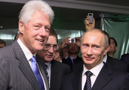 <b>Drawing close?</b> Russian Prime Minister Vladimir Putin, right, and former US President Bill Clinton seen during a reception hosted by Putin for participants of the World Economic Forum. Clinton must have thought he'd heard it all. But in a new era of billion-dollar bailouts, state control of the economy and bank nationalization, he discovered an unexpected champion of liberal markets: Vladimir Putin.