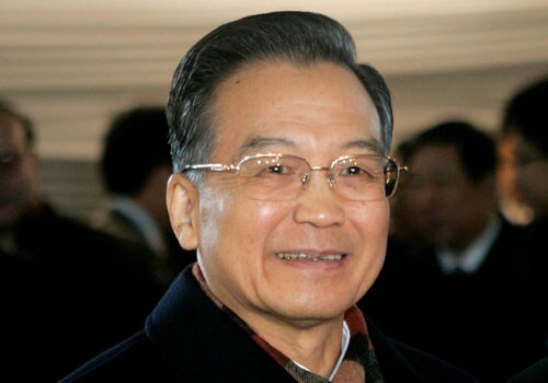 <b>United with the rest of the world:</b> Chinese Premier Wen Jiabao smiles as he arrives at the World Economic Forum. With the capitalist world suffering its worst battering since the Great Depression, the words of communist China's Premier Wen Jiabao and former communist Russia's prime minister Vladimir Putin will dominate the start of the elite five-day meeting.