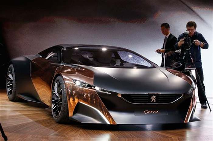 Rank #9: Peugeot Onyx Concept<br /><br />
Another concept that catches the eye is the Onyx range of future mobility products. A different concept from Peugeot, this range includes a supercar, a 3-wheeled motor-scooter and a bicycle, all using copper in their styling. However, the highlight is the supercar, designed by an Indian, Sandeep Bhambra, who works in Peugeot's design department.