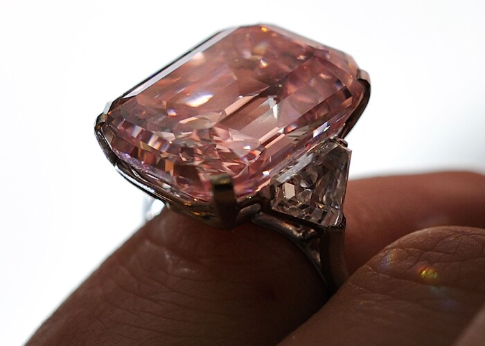 Bidding for the 24.78-carat pink diamond gem, classified by the Gemological Institute of America as "fancy intense pink started at 12.65 million pounds, but the bidding quickly surpassed the previous record.(Photo: AFP)