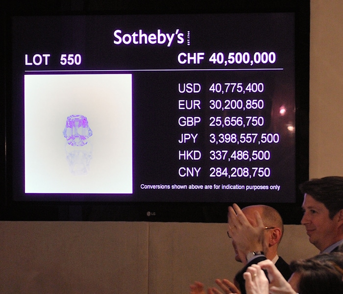 Sotheby's had valued the 24.78 carat Fancy Intense Pink diamond mounted on a ring at $27-38 million ahead of the sale in a luxury lakeside hotel in Geneva. But intense bidding wiped out the record of over $24 million set during an auction in December 2008 in the sale of a grey-blue diamond Wittelsbach. (Photo: AFP)