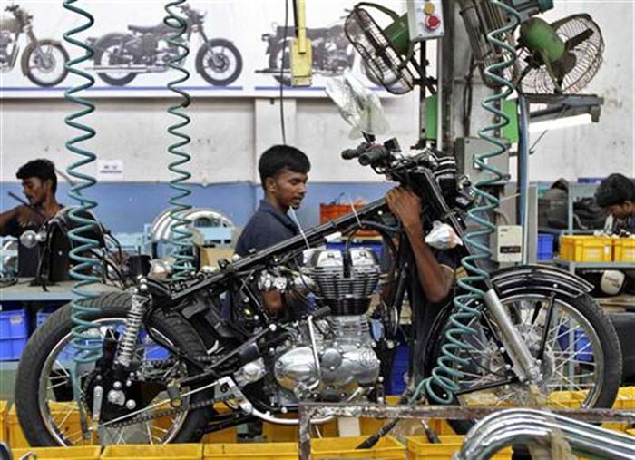 A worker pieces together a bike at the plant.