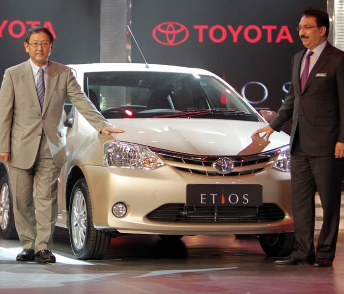 Toyota's seriousness with Etios is evident from the fact that for this it has invested Rs 3,200 crore on a new plant near Bangalore with an annual capacity of 70,000.<br></br>
Toyota Motor Corp. President Akio Toyoda, left, and Toyota Kirloskar Motor Vice Chairman Vikram Kirloskar pose with the company's new car Etios at its launch in Bangalore on December 1, 2010. (AP Photo)