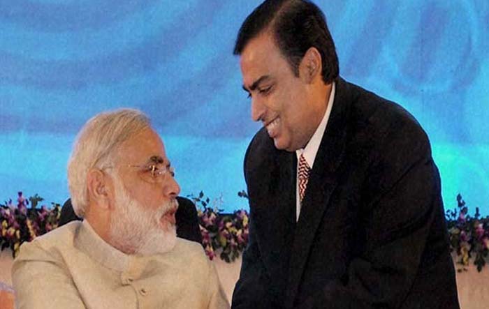 Reliance Industries chairman Mukesh Ambani greeting the Gujarat Chief Minister during the inaugural function of Vibrant Gujarat global summit. (Photo: AFP)