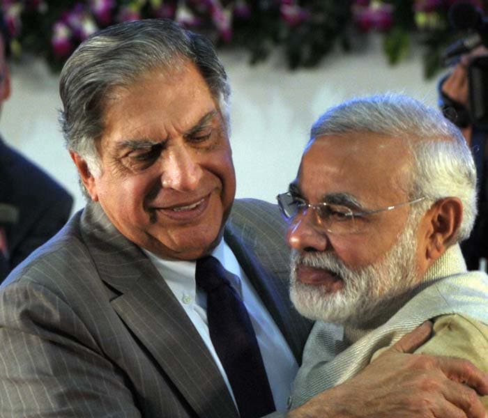 Tata Group chairman Ratan Tata greeting Narandra Modi on the first day of the event. (Photo: AFP)