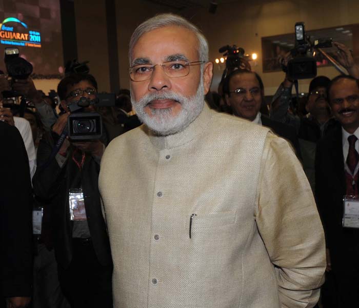 Gujarat chief minister Narendra Modi arriving at Vibrant Gujarat 2011 at Mahatma Mandir in Gandhinagar, some 30 km from Ahmedabad on January 12, 2010. The summit is aimed to facilitate and promote business opportunities for the participating countries in Gujarat, in India, and across the world. (Photo: AFP)