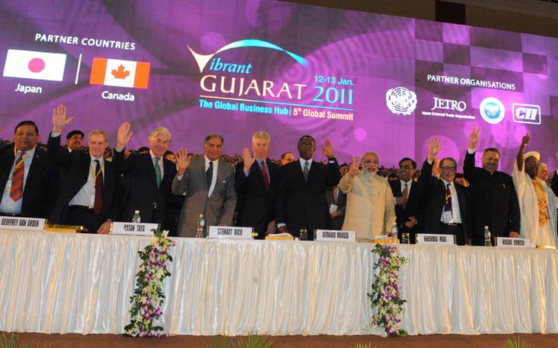 On the first day of the show, the Gujarat government said it has got investment commitments totalling nearly Rs 15 lakh crore reflecting the state's pristine position as a corporate destination.<br><br>Narendra Modi and participating member, wave during Vibrant Gujarat 2011.