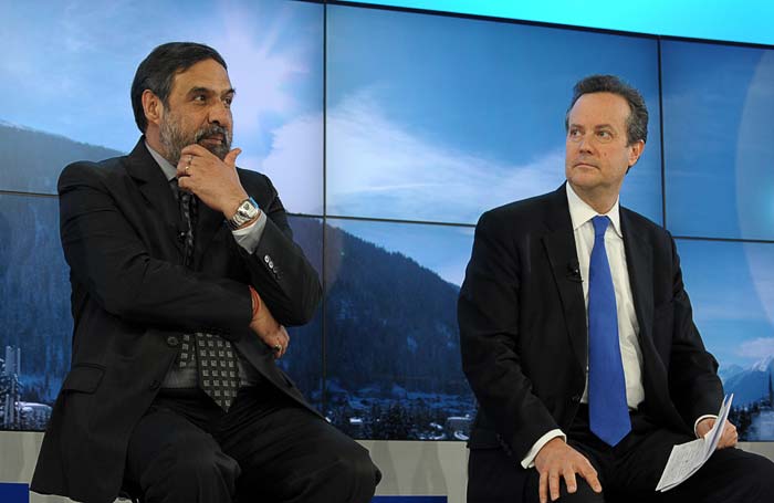 Standard and Poor's President Douglas Peterson (R) and Indian commerce and industry minister Anand Sharma take part in a session at the World Economic Forum 2012 in Davos.