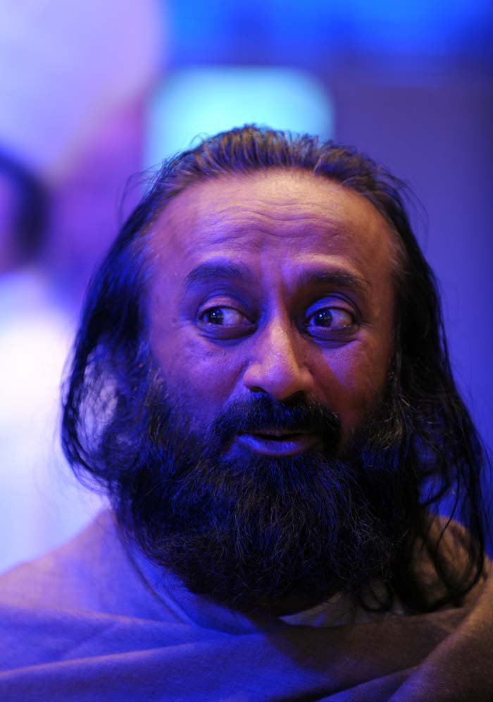 Art of Living Foundation leader Shri Ravi Shankar listens to participants at the the World Economic Forum (WEF) in Davos.