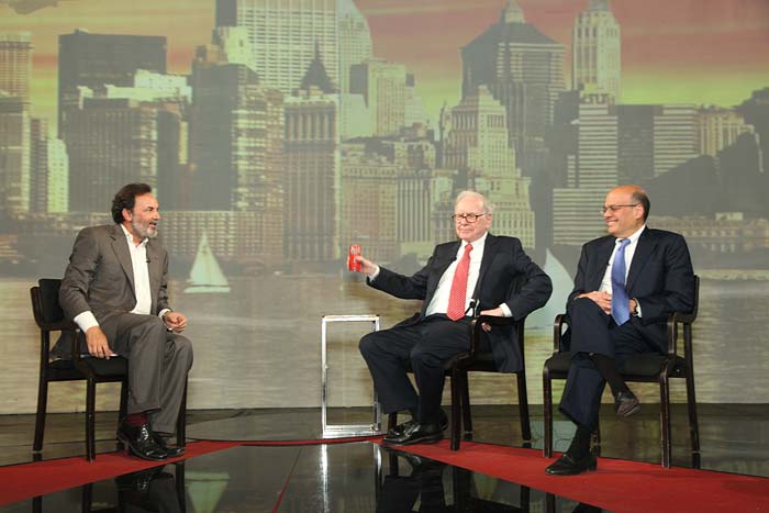 Buffett holding a can of Coca-Cola. He holds a stake in the Coca-Cola company.<br><br>Buffett said that he invests in things that he understands - in good businesses run by people he admires and at a price that makes sense.<br><br>Replying to a question, he said he doesn't invest in IT companies because he does not understand the business model.