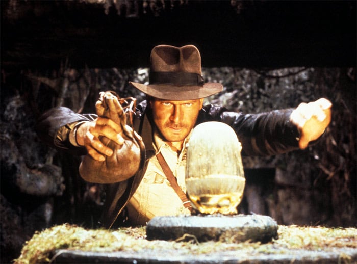 <b>Raiders of the Lost Ark</b> (1981): <b>Directed by</b> Steven Spielberg. <b>Starring</b>: Harrison Ford, Karen Allen, Paul Freeman, Ronald Lacey, John Rhys-Davies, Denholm Elliott. <b>Memorable Quote</b>: "All your life has been spent in pursuit of archaeological relics. Inside the Ark are treasures beyond your wildest aspirations. You want to see it opened as well as I. Indiana, we are simply passing through history. This, this *is* history." (Belloq)