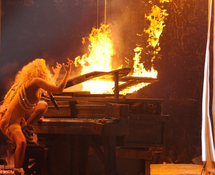 True to her reputation, Lady Gaga delivered an eye-popping performance on her new single <I>Bad Romance</I>. She matched a flesh-colored bodysuit with flashing white accessories that mimicked a rib cage. She then picked up her mic stand and smashed open a glass enclosure housing a piano. She climbed up, sat down and played <I>Speechless</I> while flames enveloped the wooden instrument. (Photo: AFP)