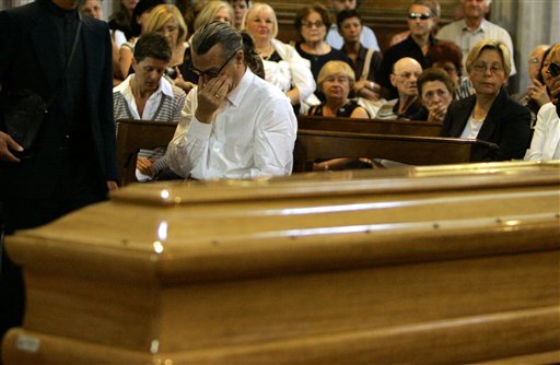 German film director Wim Wenders gestures near the coffin of the late Italian director Michelangelo Antonioni at the St Giorgio cathedral in Ferrara.