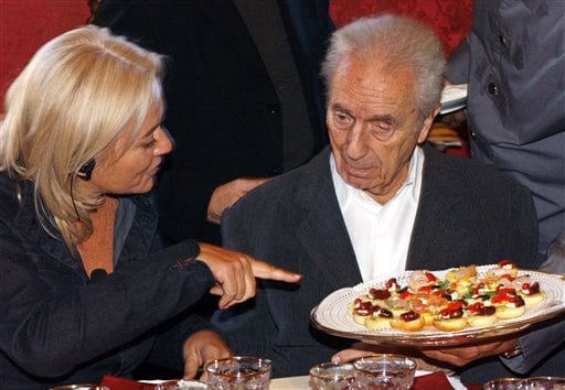 Antonioni, right, is offered cakes as his wife Enrica looks on during celebrations for his 90th birthday, in Rome, Sunday, Sept 29, 2002.