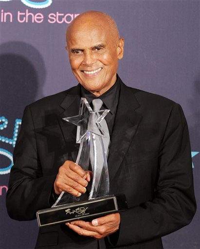 Harry Belafonte holds the BET Humanitarian Award during the 6th annual BET Awards.