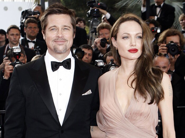 Pitt buys new house to get over Jolie?