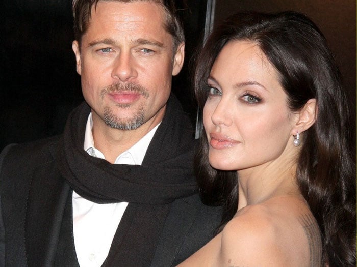 Pitt buys new house to get over Jolie?