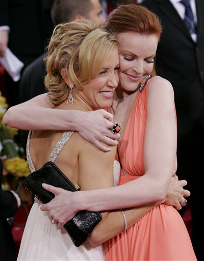 Marcia Cross, right, and Felicity Huffman, both nominated for best actress in a television musical or comedy series for their work on <I>Desperate Housewives,</I> greet each other as they arrive for the 63rd Annual Golden Globe Awards.