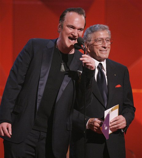 Quentin Tarantino, left, and Tony Bennett present the award for record of the year during the 49th Annual Grammy Awards
