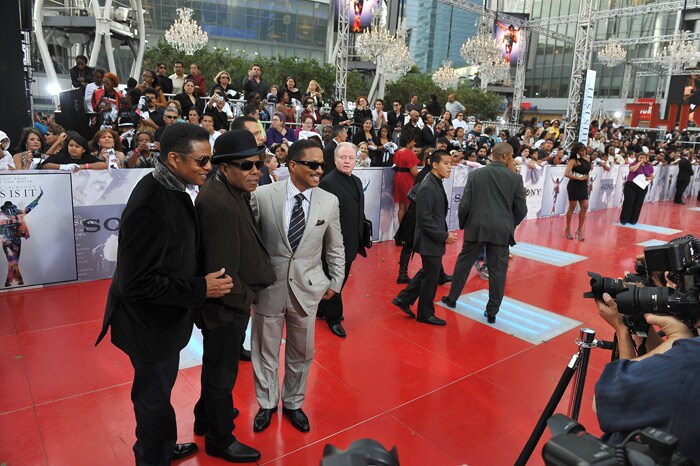 Michael Jackson's brothers, from left to right, Randy Jackson, Tito Jackson and Marlon Jackson, arrive for the world premiere of the Michael Jackson?s ?This is it? at the Noika Theatre at LA Live on October 27, 2009 in Los Angeles. (Photo: AFP)