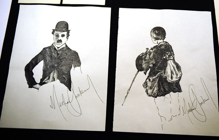 The other items at the auction included shoes and socks, a portrait of Charlie Chaplin drawn by Jackson as a child, an autographed shirt, a 1995 mercedes, posters, letters and a black jacket that the singer wore during his 'Bad World Tour' in 1987. (Photo: AFP)