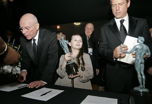 Alan Arkin, left, Abigail Breslin, center, and Greg Kinnear receive their awards for outstanding performance by a cast in a motion picture for their work in Little Miss Sunshine, at the 13th Annual Screen Actors Guild Awards.