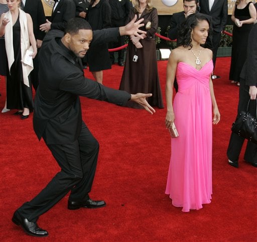 Will Smith, left, nominated for outstanding performance by a male actor in a leading role for his work in The Pursuit of Happyness, and his wife Jada Pinkett Smith,right, arrive at the 13th Annual Screen Actors Guild Awards.